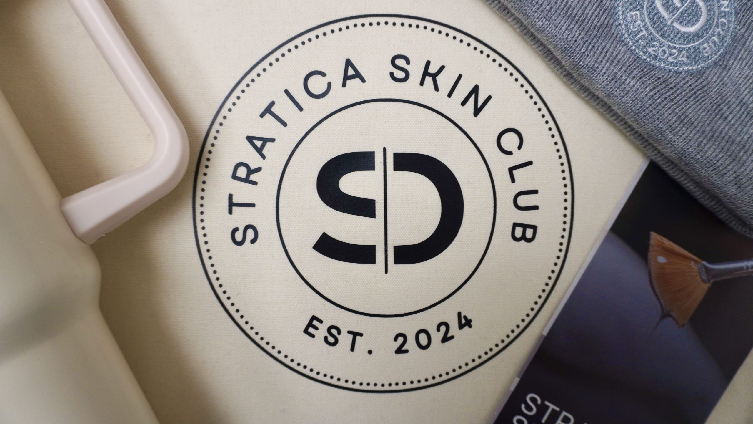 Stratica Skin Club Merchandise and logo